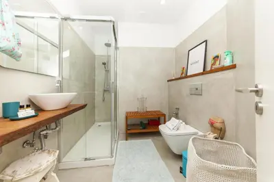 a bathroom with a shower and a toilet and a sink at C18 - Church Square Apartment in Praia da Luz in Luz