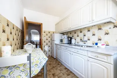 a living room with a couch and a table at Villas Brites nº4 in Burgau
