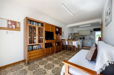 a living room with a bed and a kitchen at Villas Brites nº5 in Burgau