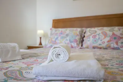 a bedroom with two beds and a window at Villas Brites nº3 in Burgau