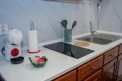 a kitchen counter top with a sink and a counter top at Mountain View Star in Estreito da Calheta