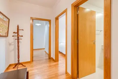 a hallway with a door leading to a bedroom at Jardim do Jasmineiro by Amazing Madeira in Funchal
