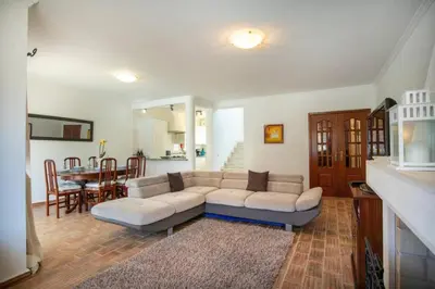 a living room with a couch and a table at Villa Carraig in Luz