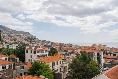 a view of a city with houses and roofs at FLH Funchal Studio with Balcony in Funchal