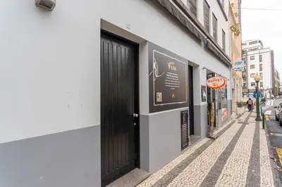 a black door on the side of a building at FLH Funchal Studio with Balcony in Funchal