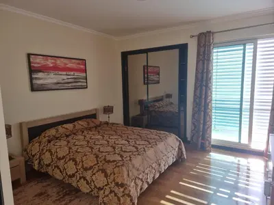 a bedroom with a bed and a large window at Magical Seaview (Free Parking) in Funchal