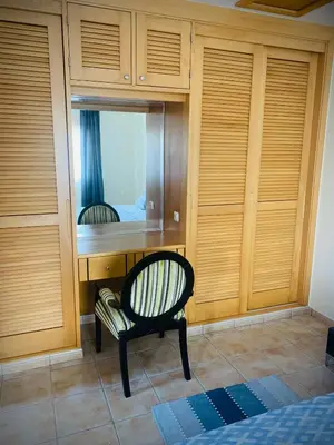 a room with a desk with a chair and a mirror at Porto Santo Casa Dourada in Porto Santo