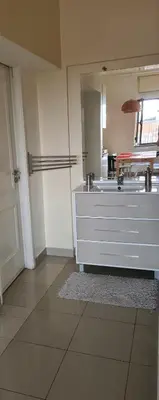 a large bathroom with a sink and a mirror at Funchal Centre Comfort in Funchal