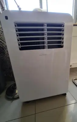 a white heater is sitting on a floor at Funchal Centre Comfort in Funchal