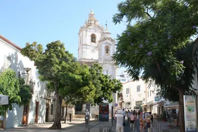a city street with a church in the background at Lagos beach condo in Lagos