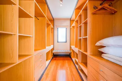 a room with wooden shelves and a bed and a window at Villa Vacuna by Amazing Madeira in Funchal