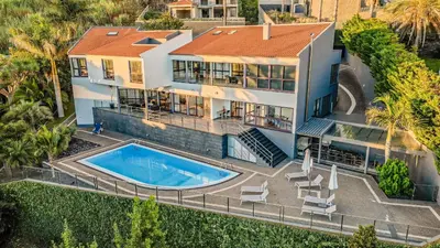an aerial view of a house with a swimming pool at Vila Crerital - By Wehost in São Gonçalo