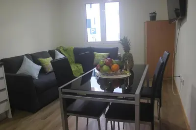 a table with a bowl of fruit on it in a living room at Torrinha & Sá in Funchal