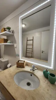 a bathroom sink with a large mirror above it at Thelighthouse Porto Santo in Porto Santo