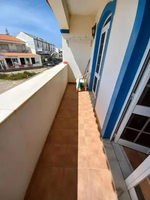 a balcony of a house with a chair on it at Cool Villas T1 in Sagres