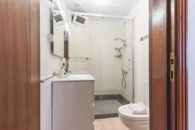 a bathroom with a shower and a sink and a toilet at Avelino Apartment by Atlantic Holiday in Machico