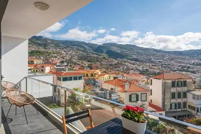a view of a city from the balcony of a house at Casa do Castelo by An Island Apart in Funchal