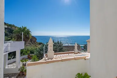 a view of the ocean from the balcony of a house at Casa da Praia 1 in Budens