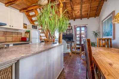 a kitchen with a large counter top in a room at Casa da Praia 1 in Budens