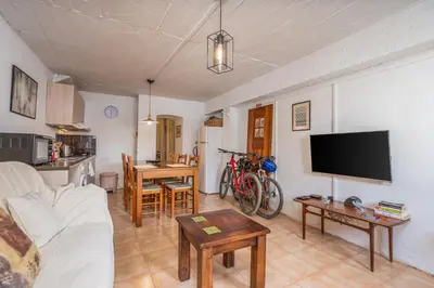 a living room with a couch and a table at Casa da Praia 2 in Budens