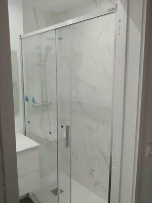 a shower with a glass door in a bathroom at Madeira, 3 bedroom apartment with ocean views in Funchal in Funchal