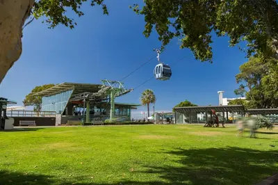 a gondola ride in a park in front of a building at Casa Caetano by An Island Apart in Funchal