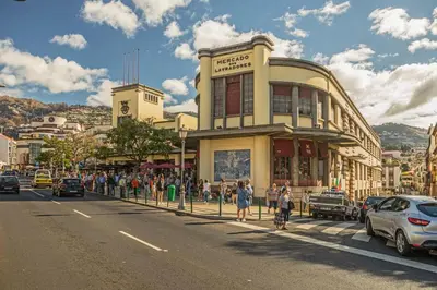 a group of people standing outside of a building on a street at Casa Caetano by An Island Apart in Funchal