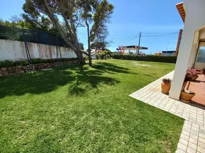 a yard of a house with a tree in it at Cool Villas T2 in Sagres