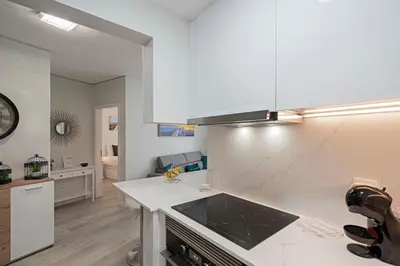 a kitchen with a counter top and a stove top oven at Varandas do Lido I by An Island Apart in Funchal