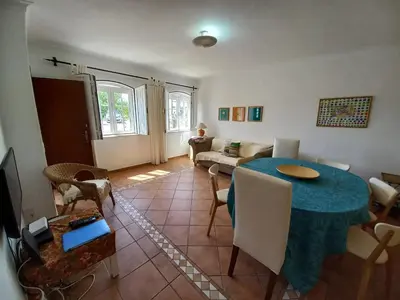 a living room with a table and a couch at Cool Villas T4 in Sagres