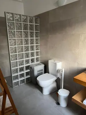 a bathroom with a toilet and a sink in it at Casa do Avô in Ponta do Sol