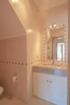 a bathroom with a sink and a mirror at Villa Acacias 18, Brisa do Mar in Luz