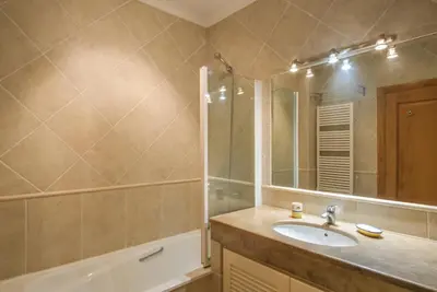 a bathroom with a sink and a shower and a mirror at Villa Acacias 18, Brisa do Mar in Luz