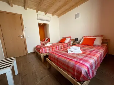 a room with two beds in a room at Casa Arenga in Almádena