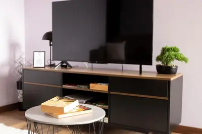 a entertainment center with a tv on top of it at Village Center Two Bedroom Apartment in Porto Moniz