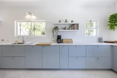 a kitchen with white cabinets and a sink at CoolHouses Algarve Lagos, 4 bed single-story House, pool and amazing panoramic views, Casa Fernanda in Lagos