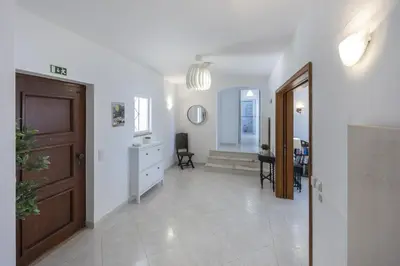 a living room with a door and a hallway at CoolHouses Algarve Lagos, 4 bed single-story House, pool and amazing panoramic views, Casa Fernanda in Lagos