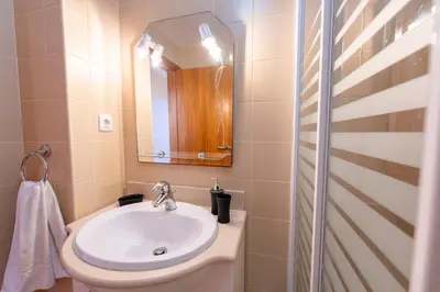 a bathroom with a sink and a mirror at Vista Mar in Porto Santo