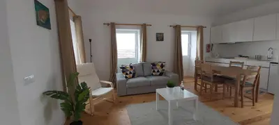 a living room with a couch and a table at House Nobrega of Madeira in Arco da Calheta