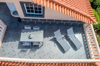 an overhead view of a patio with chairs and a table at CASA POR DO SOL in Calheta
