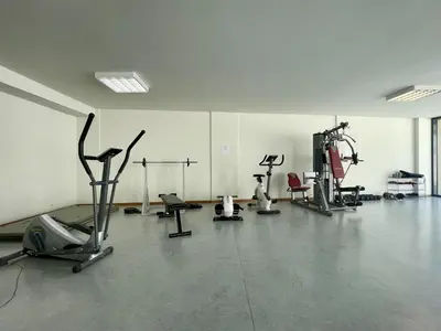 a gym with several exercise equipment in a room at Terrace Apartment by Atlantic Holiday in Funchal