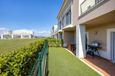 a balcony of a house with a fence at Casa Malhotra at Boa Vista Golf Resort, Bayview Village in Lagos