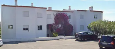 a building with a painting on the side of it at Serenity bright flat T3, 2 terraces seaview 600m beach in Luz