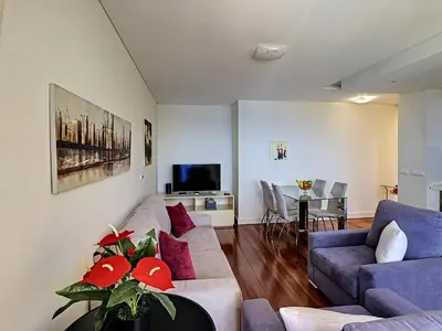 a living room with a couch and a table at Vila Formosa Top View by LovelyStay in Funchal