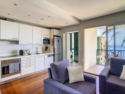 a kitchen with a couch and a chair in a room at Vila Formosa Top View by LovelyStay in Funchal