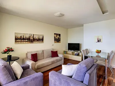 a living room with two couches and a tv at Vila Formosa Top View by LovelyStay in Funchal