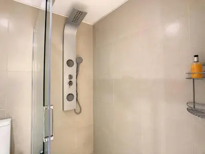 a bathroom with a shower and a toilet at Vila Formosa Top View by LovelyStay in Funchal