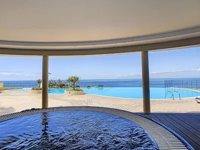 a pool with a view of the ocean from a house at Vila Formosa Top View by LovelyStay in Funchal