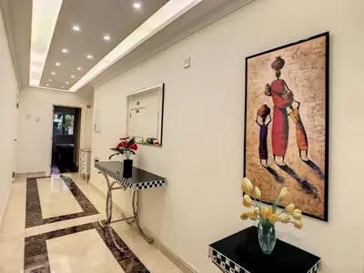 a hallway with a painting on the wall at Vila Formosa Top View by LovelyStay in Funchal