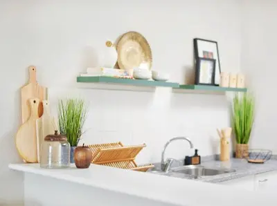 a kitchen counter with a sink and some shelves at Lovely apartment with pool and sea view in Funchal